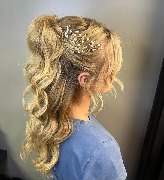 Elegant Curly Ponytail with Pearl Accessories