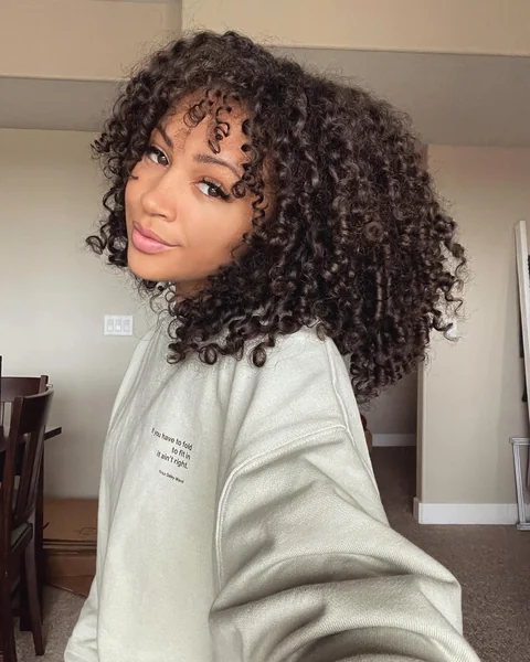 Defined Natural Curls with Curly Bangs