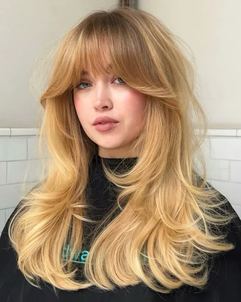 Long Blonde Wavy Hair with Wispy Bangs