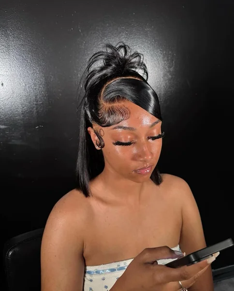 Sleek High Ponytail with Swoop and Curls