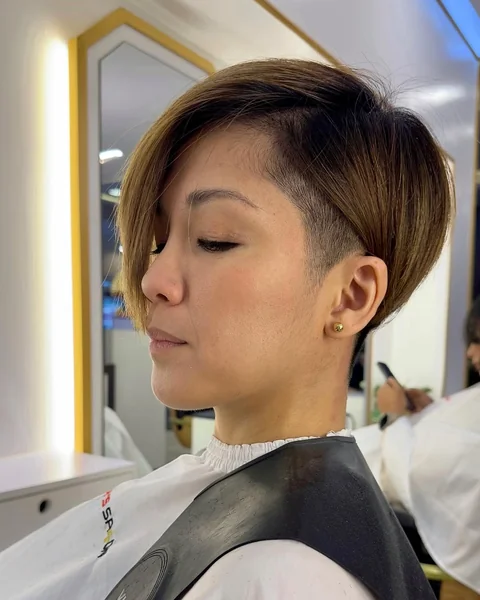 Edgy Honey-Toned Pixie with Undercut Detail