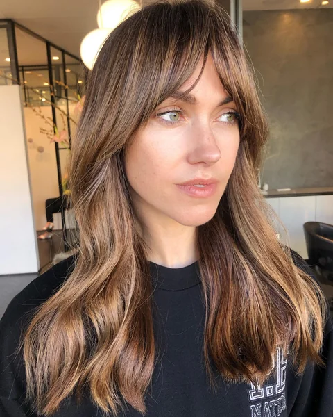 Wavy Balayage Hair with Side Bangs