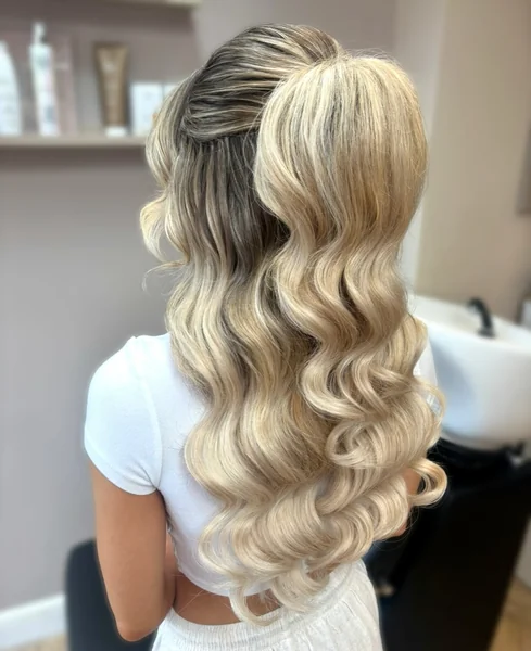 Voluminous Blonde Wavy Ponytail