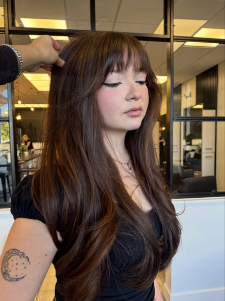 Long Dark Brown Wavy Hair with Wispy Curtain Bangs