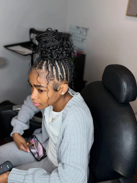 Knotless Braids Updo with High Curly Bun