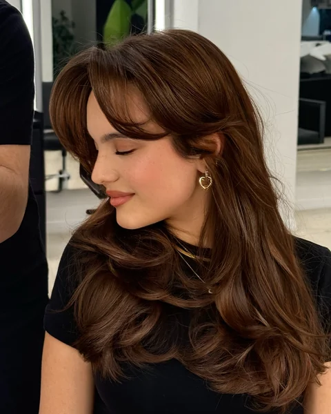 Side-Swept Fringe on Long Chestnut Hair