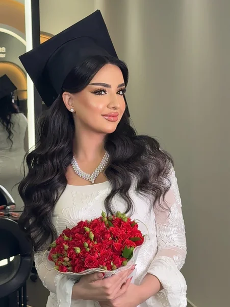 Long Black Waves Under Graduation Cap