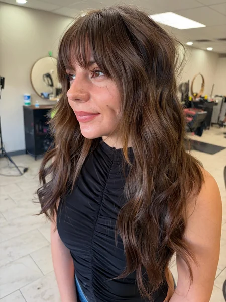 Long Dark Wavy Hair with Curtain Bangs