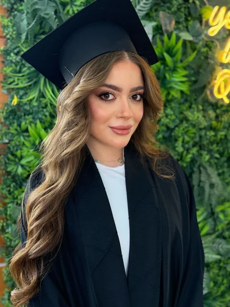 Warm Blonde Waves Under Graduation Cap