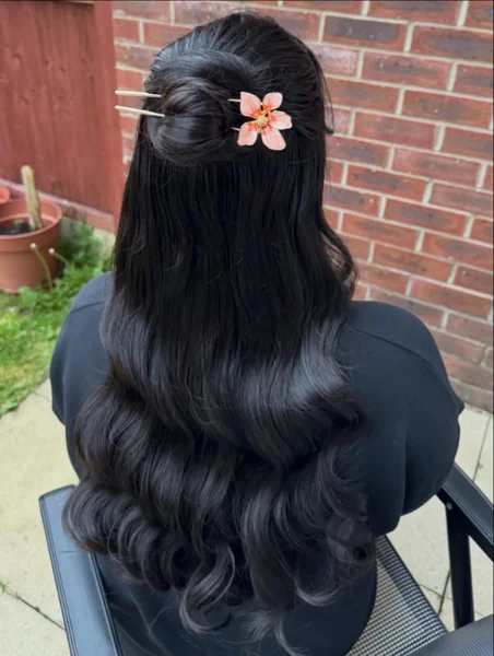 Simple Half Up on Black Hair with Flower Pin