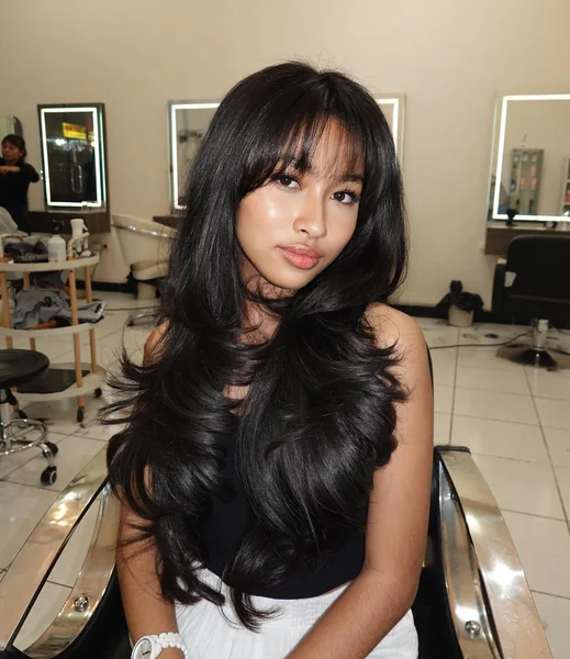 Long Black Voluminous Hair with Curtain Bangs