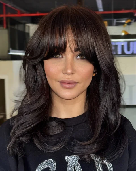 Dramatic Side-Swept Bangs for Round Face