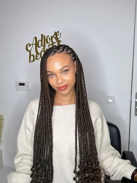 Fulani Braids with Brown Curly Ends and Simple Parting Design