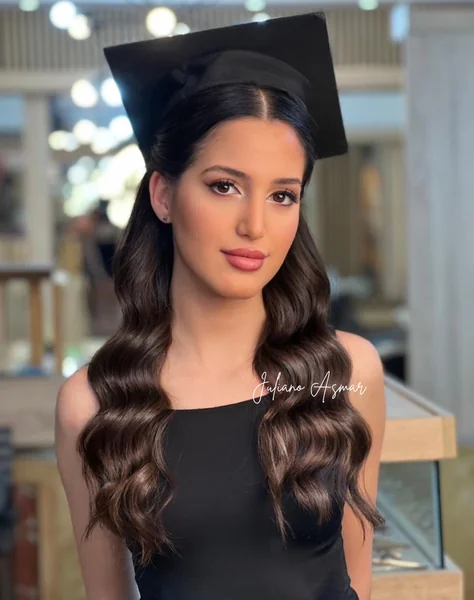 Sleek Waves Under Black Graduation Cap