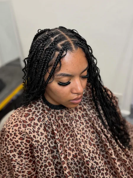 Medium Black Knotless Braids with Curly Leave-Out
