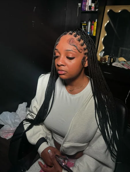Small Black Knotless Braids with Swooped Baby Hairs