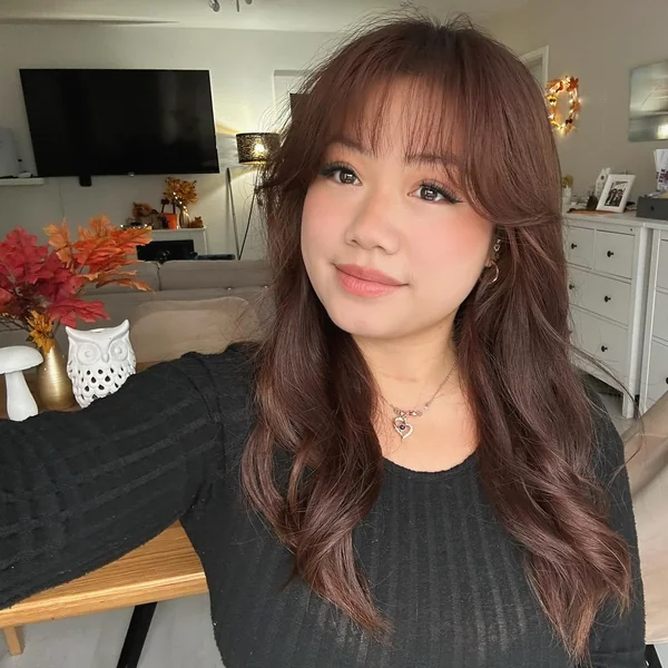 Wavy Reddish-Brown Hair with Side Bangs