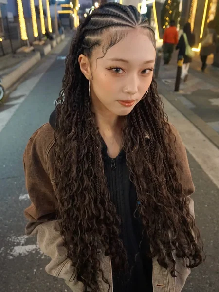 Cornrows with Long Curly Extensions at Night