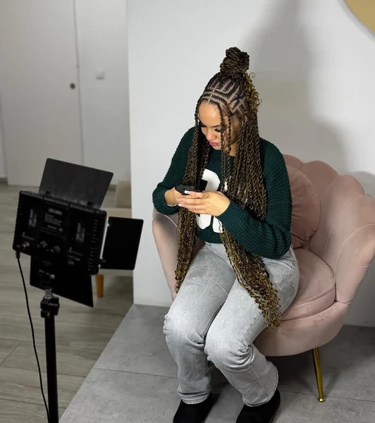 Long Brown Twists Half-Up Bun with Caramel Highlights