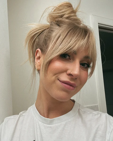 Messy Bun Updo with Wispy Side Bangs