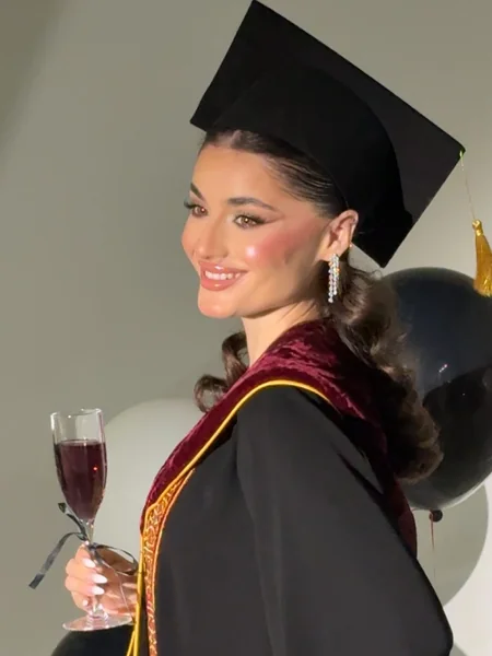 Sleek Ponytail Under Graduation Cap