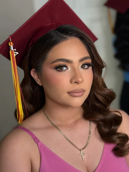 Side-Swept Waves Under Maroon Graduation Cap