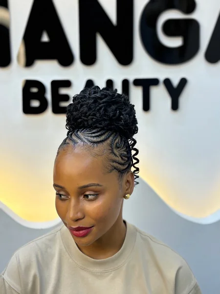 Cornrow Updo with High Curly Bun and Swirling Detail