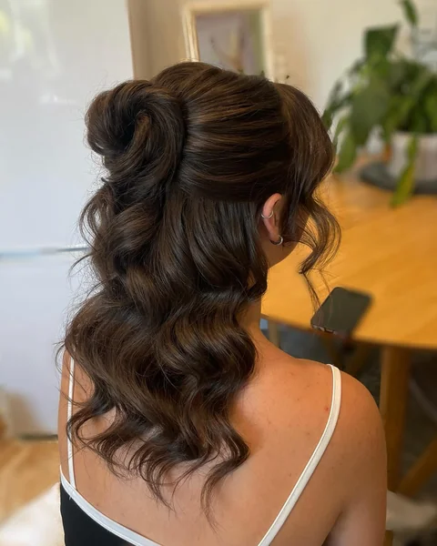 Voluminous Twisted Half Up Bun on Dark Hair