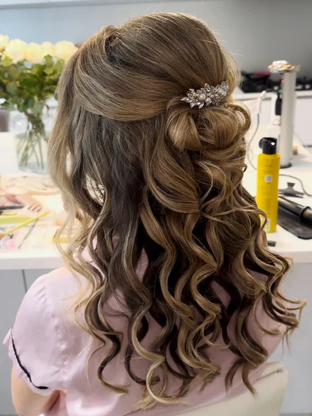 Half Up Twisted Bun with Jeweled Pin on Curly Hair