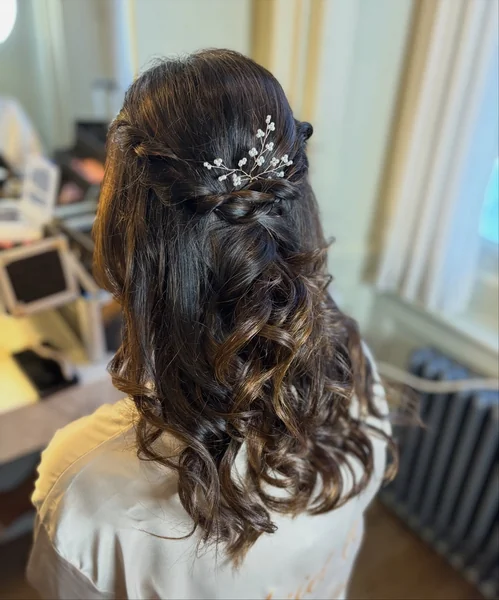 Half Up Twist with Pearl Pin on Dark Hair