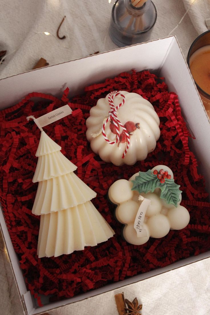 This may contain: an open box with candles and decorations in it