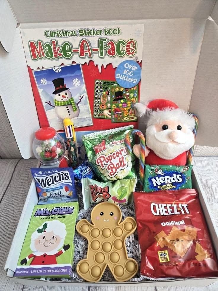 This may contain: a box filled with christmas treats and toys