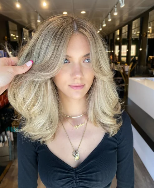 70s Voluminous Layers for Blonde Medium Hair