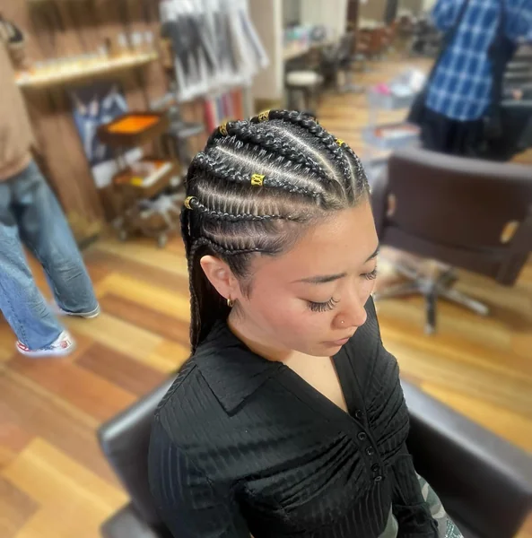 Cornrow Hairstyle with Gold Beads