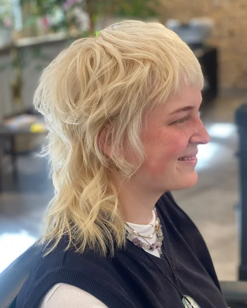 Bold Platinum Blonde Shag with Wavy Tail