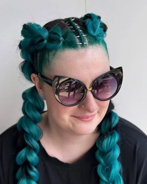 Bold Teal Braids with Edgy Hair Accessories