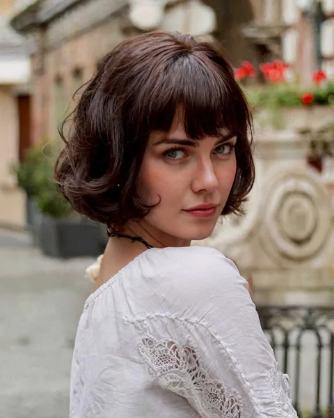 Bouncy Dark Bob with Voluminous Waves and Fringe