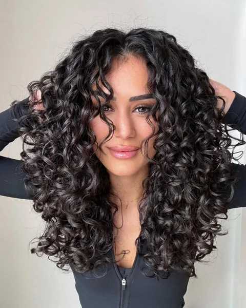 Bouncy and Defined Dark Curly Hair with Volume