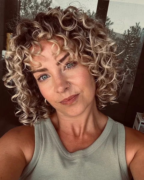 Bright Blonde Chin-Length Coils with Curly Fringe