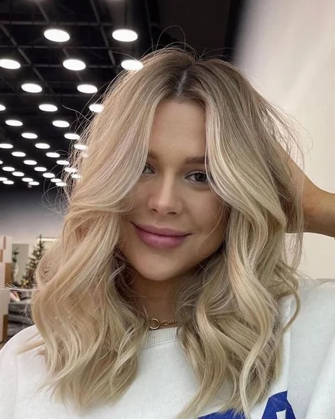 Bright Blonde Lob with Voluminous Loose Waves