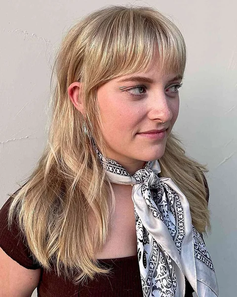 Bright Blonde Shag with Soft Layered Bangs