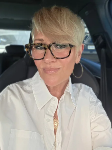 Chic Blonde Pixie with Voluminous Sweeping Fringe
