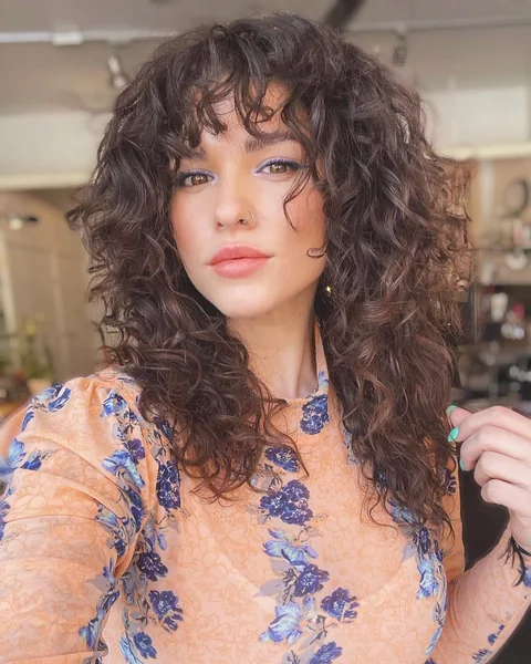 Curly Brunette Long Shag with Full Voluminous Layers