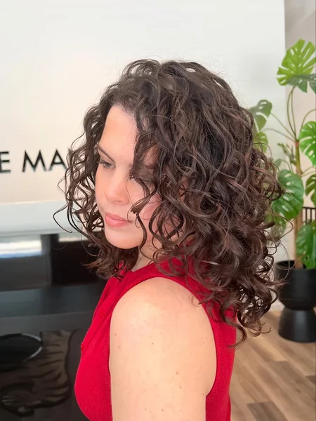 Defined Curly Shoulder Length Layered Lob