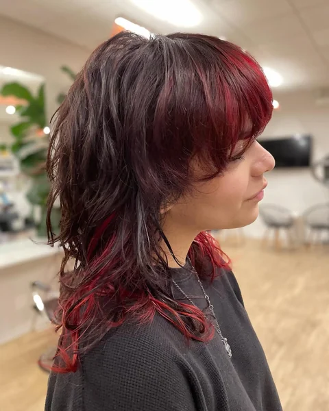 Edgy Dark Shag with Dramatic Red Underlayers