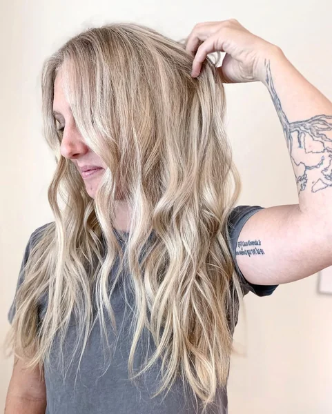 Effortless Beachy Blonde Waves with Sweeping Fringe