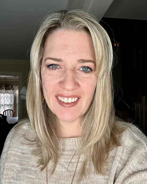 Effortless Layered Blonde Medium Length Cut