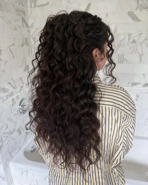 High Half-Up Ponytail with Cascading Voluminous Curls