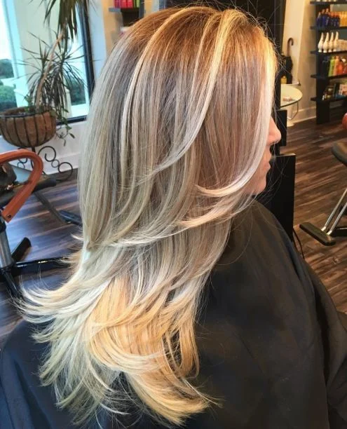 Layered Honey Blonde Cut with Feathered Ends