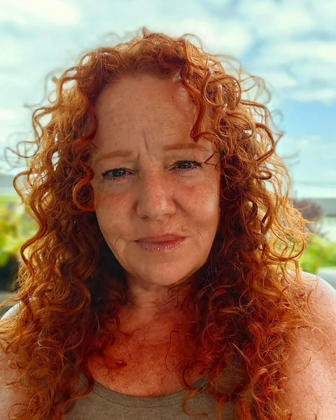 Long Vibrant Copper Curls with Flowing Texture